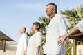 Group of seniors practicing yoga in the morning Royalty Free Stock Photo