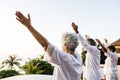 Group of seniors practicing yoga in the morning Royalty Free Stock Photo