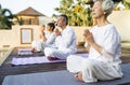 Group of seniors practicing yoga in the morning Royalty Free Stock Photo