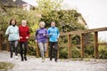 Group of seniors running outdoors in the old town. Royalty Free Stock Photo