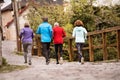 Group of seniors running outdoors in the old town. Royalty Free Stock Photo