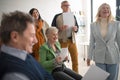 Group of seniors singing together at choir rehearsal. Royalty Free Stock Photo