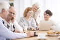 Group of seniors sitting at table