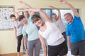 Group of seniors stretching Royalty Free Stock Photo