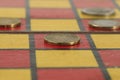 A group of several EUR coins is on the chessboard