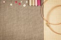 Group of sewing objects lying flat on a natural linen