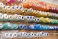 group of sewing threads in skeins. A bunch of large multicolored spools of thread. Atelier workshop. A set of colored Royalty Free Stock Photo