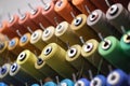 group of sewing threads in skeins. A bunch of large multicolored spools of thread. Atelier workshop. A set of colored Royalty Free Stock Photo