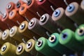 group of sewing threads in skeins. A bunch of large multicolored spools of thread. Atelier workshop. A set of colored Royalty Free Stock Photo