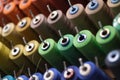 group of sewing threads in skeins. A bunch of large multicolored spools of thread. Atelier workshop. A set of colored Royalty Free Stock Photo