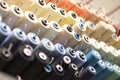 group of sewing threads in skeins. A bunch of large multicolored spools of thread. Atelier workshop. A set of colored Royalty Free Stock Photo