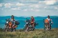 Group of sexy woman on motorcycle. Woman rider, active girsl riding on the motorbike in bikers tour, adventure mountains Royalty Free Stock Photo