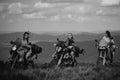 Group of sexy woman on motorcycle. Woman rider, active girsl riding on the motorbike in bikers tour on forest road Royalty Free Stock Photo