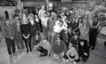 group shot of Neighbours actors and crew in the auto workshop on set in the early 90\'s