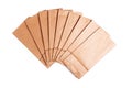 Group of simple blank brown small paper bags set spread out. Lots of tiny new flat biodegradable, recyclable eco friendly Royalty Free Stock Photo