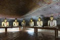 Group of sitting Buddha statues in cave buddhist temple Royalty Free Stock Photo