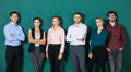 Group of six businesspeople colleague in modern company standing together. The idea for team work in a business office Royalty Free Stock Photo