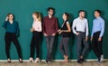 Group of six businesspeople colleague in modern company standing together. The idea for team work in a business office. They are Royalty Free Stock Photo