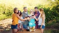 Group of Six Enjoying Wine Tour, Toasting and Tasting Red Wine amidst Lush Vineyards. Cheers to Wine and Embracing the Harvest