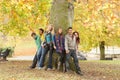 Group Of Six Teenage Friends Leaning Against Tree Royalty Free Stock Photo