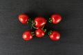 Red cherry tomato on grey stone Royalty Free Stock Photo