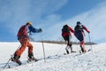 Group of ski-mountaineers climb the mountain on skis