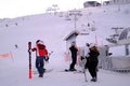 Group, skiers and snowboarders on skis at foot of snowy mountain, preparation for ascent from slope in Levi ski resort, tourism, Royalty Free Stock Photo