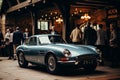 Group of skilled mechanics collaborating to restore a classic car to its former glory Royalty Free Stock Photo