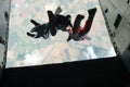 Group of skydivers exit an airplane