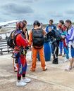 Group of skydivers prepaire to skydive.