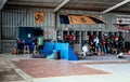 Group of skydivers preparing for jumping event, checking equipment. Royalty Free Stock Photo