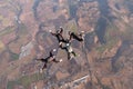 Group skydiving. Team jump. Four skydivers. Royalty Free Stock Photo