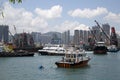 Group skyscrapers and boats in pier Hongkong