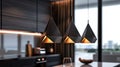 a group of sleek, modern pendant lights featuring geometric lampshades, suspended gracefully from regular electric