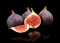 Group sliced figs on black background