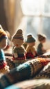 A group of small knitted dolls sitting on a blanket, AI