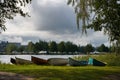 Group of small rowing boats on beach in Finland