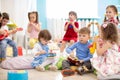 Group of children age 3-4 years playing diverse musical toys. Early musical education in kindergarten Royalty Free Stock Photo