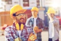 Group of smiling builders in hardhats outdoors Royalty Free Stock Photo