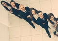 Group of smiling business people standing in a row and looking at the camera. Royalty Free Stock Photo