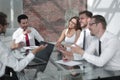 Group of smiling business people talking at the Desk Royalty Free Stock Photo