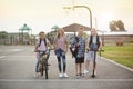 Group of smiling elementary school students on their way home Royalty Free Stock Photo