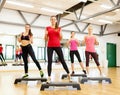 Group of smiling female doing aerobics Royalty Free Stock Photo