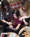 Group of smiling female students with books at school cafeteria Royalty Free Stock Photo