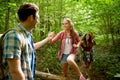 Group of smiling friends with backpacks hiking Royalty Free Stock Photo