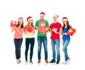 Group of smiling friends in Christmas hats