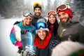 Group of smiling friends having fun Snowboarders and skiers making selfie Royalty Free Stock Photo