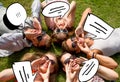 Group of smiling friends lying on grass outdoors Royalty Free Stock Photo