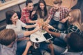 Group of smiling friends toasting glasses of champagne in office Royalty Free Stock Photo