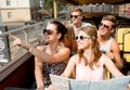 Group of smiling friends traveling by tour bus Royalty Free Stock Photo